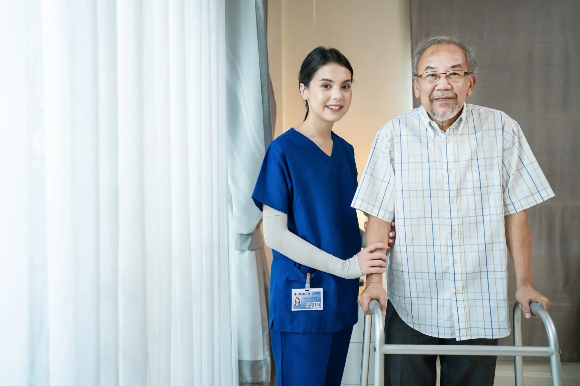Caregiver spending time with a senior client in a comfortable home setting.