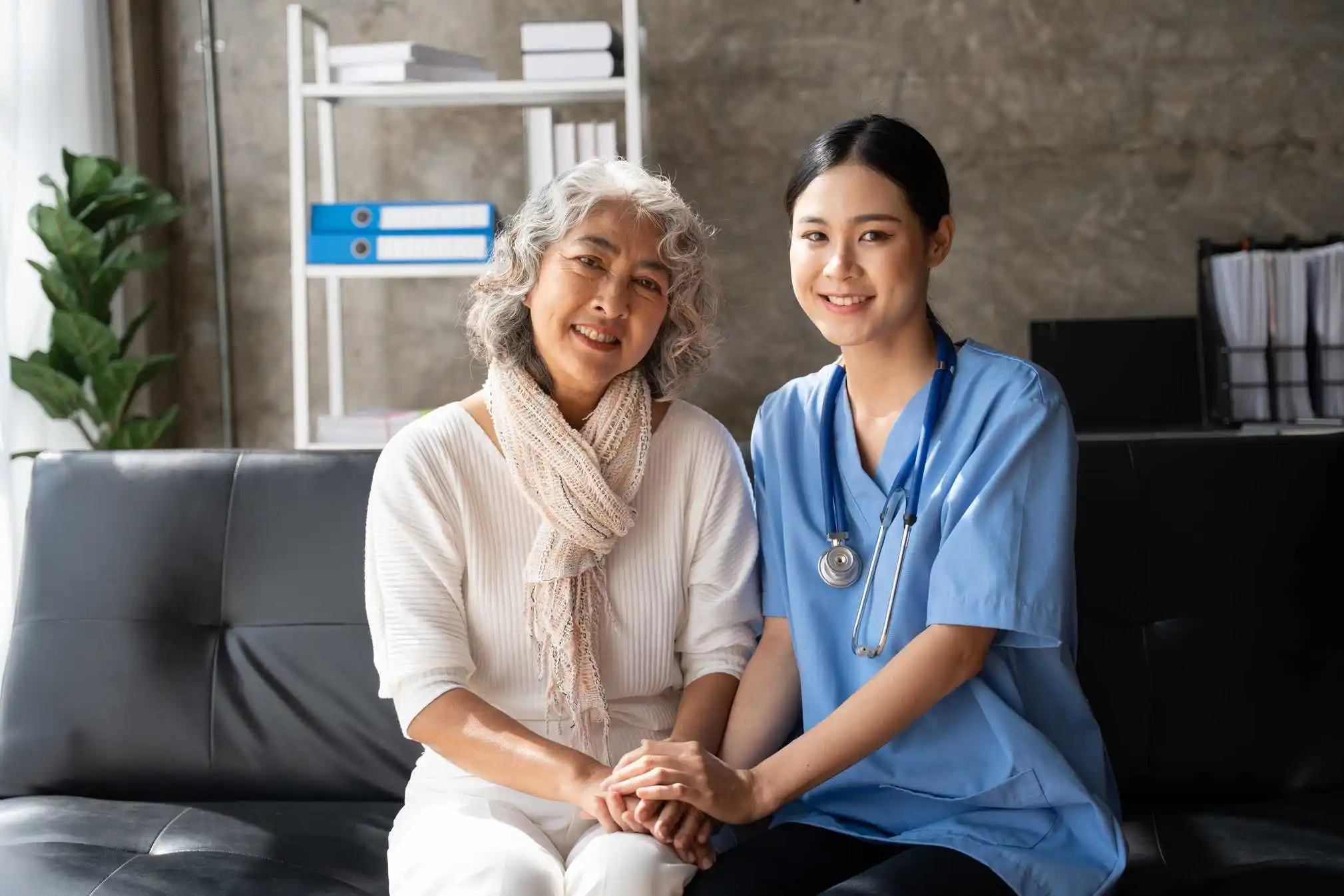 Caregiver supporting a senior with daily activities at home.