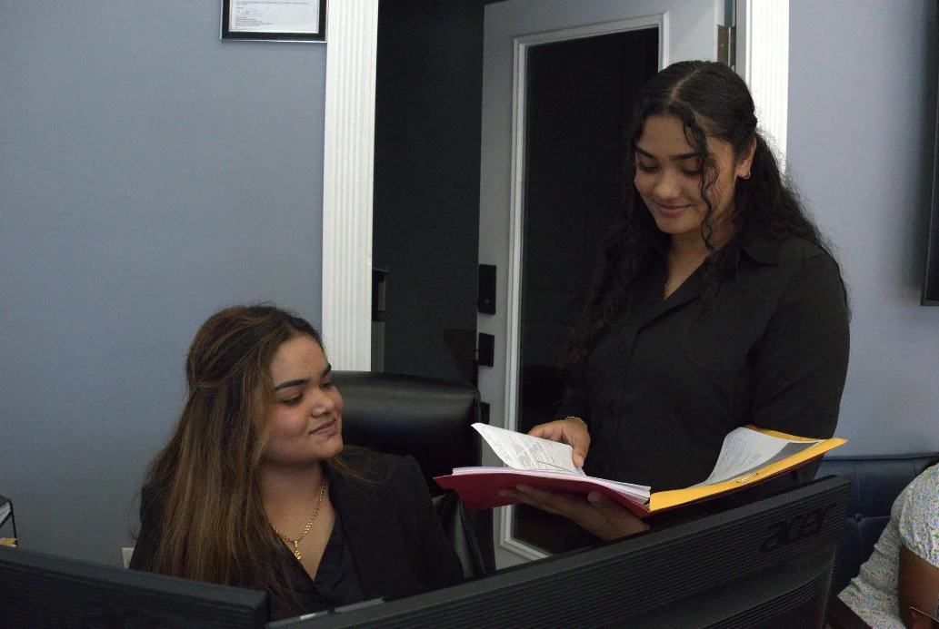 Senior client smiling with caregiver